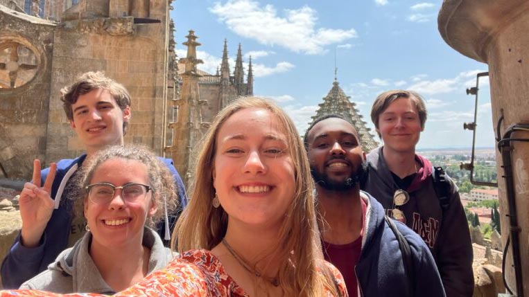 Group of students on rooftop of building during Century Singers international tour